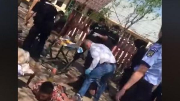 Bărbat culcat la pământ, bătut crunt de șeful Poliției din Bolintin Vale VIDEO